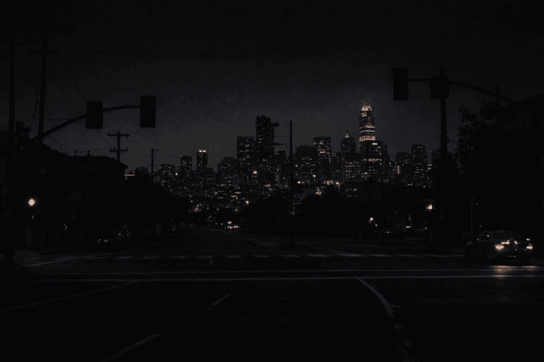 Dark San Francisco intersection during a citywide power outage, with unlit traffic signals and the downtown skyline dimly visible at night.